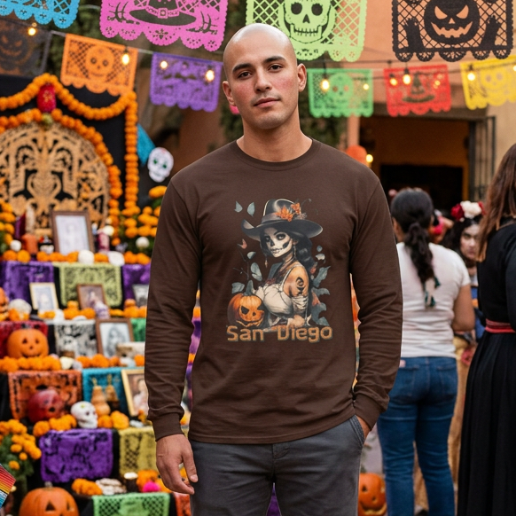 Man standing in front of a festive Halloween display with decorations and pumpkins.